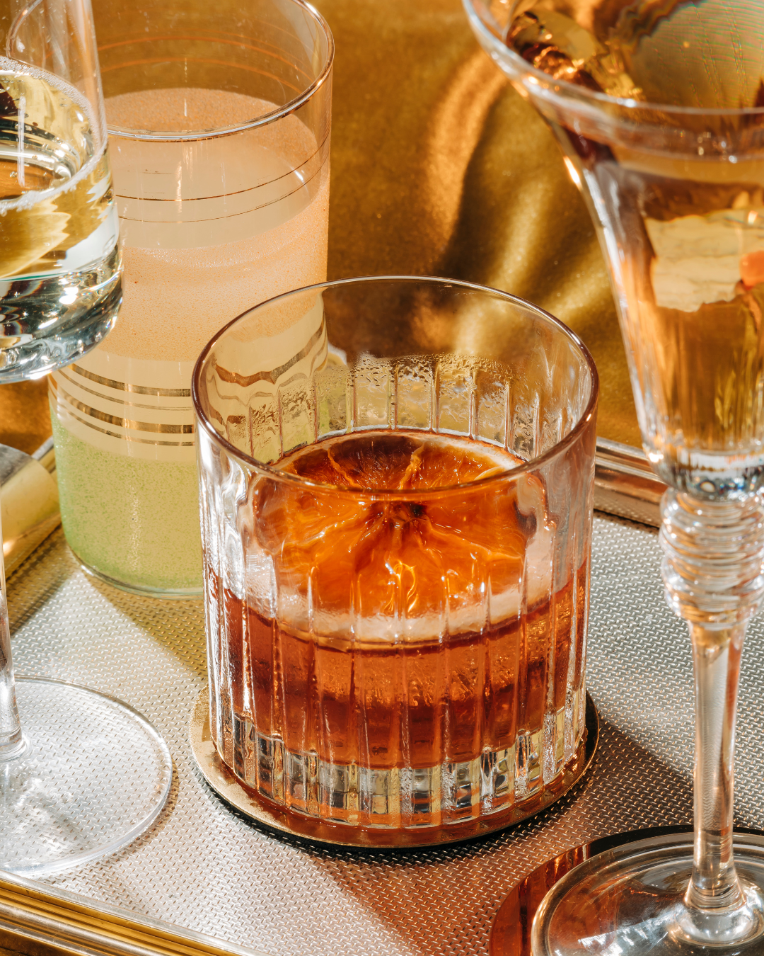 dried grapefruit slices in an old fashion glass as a cocktail garnish, cocktail garnishes, dehydrated grapefruit.