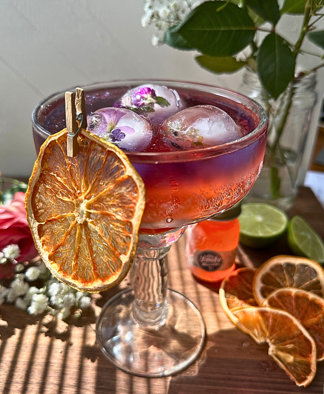 dried grapefruit slices in a cocktail as a cocktail garnish, cocktail garnishes, dehydrated grapefruit.