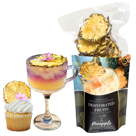 Cocktail with pineapple garnish, cupcake with pineapple slice, and bag of dehydrated pineapple slices for sale from Preserved Peel