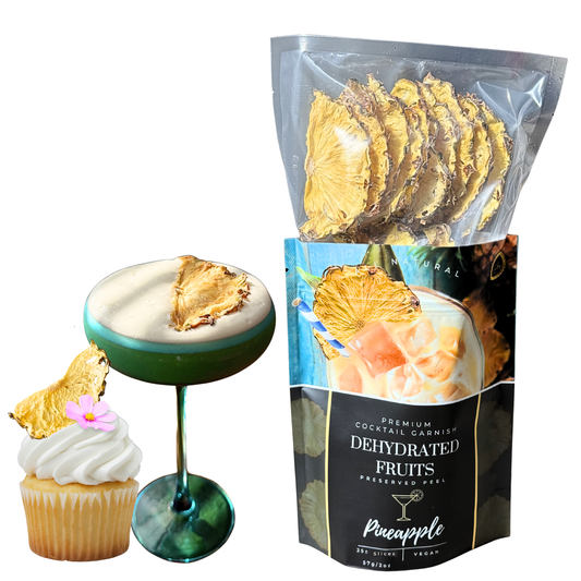 Packaged dehydrated pineapple slices with a cocktail and cupcake for decoration for sale from Preserved Peel Premium cocktail garnish company