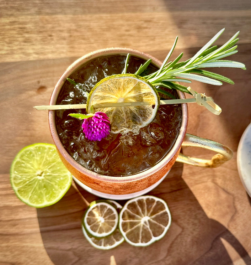 dehydrated lime wheels in a Mule cocktail as garnish from Preserved Peel 