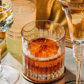 dried grapefruit slices in an old fashion glass as a cocktail garnish, cocktail garnishes, dehydrated grapefruit.