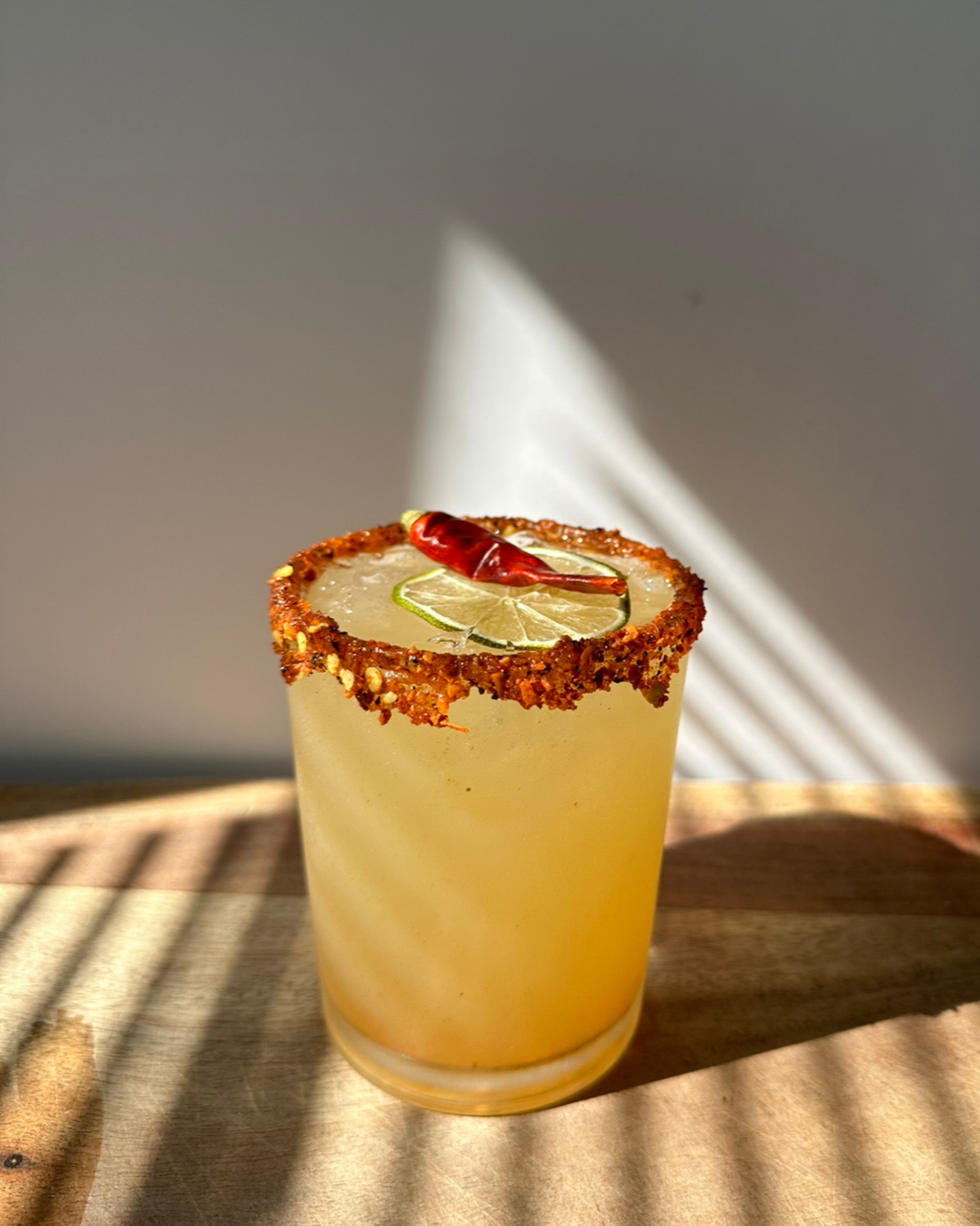 spicy margarita garnished with dried sichuan peppers from Preserved Peel